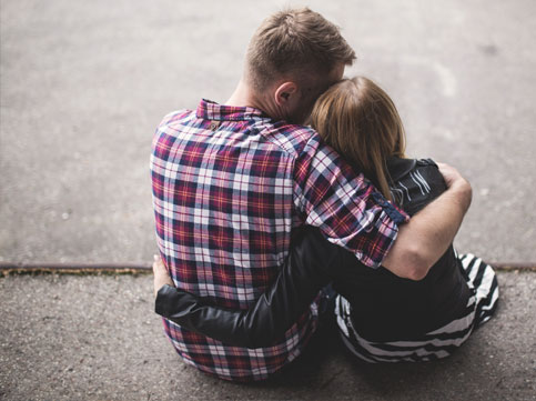 male in a flannel shirt hugging a girl wearing a leather jacket. image for supporting someone with cancer male in a flannel shirt hugging a girl wearing a leather jacket. image for supporting someone with cancer