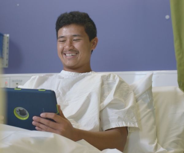 a young person in a hospital bed