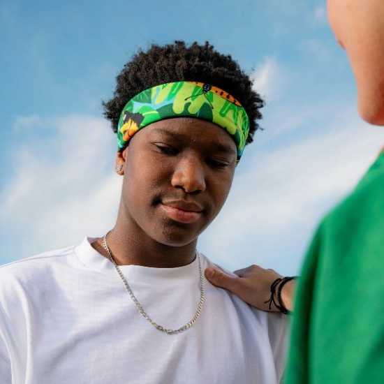 a young person getting consoled by a friend